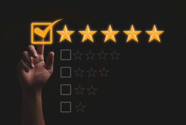 Hand touching and doing mark to five yellow stars on black background the best customer satisfaction and evaluation for good quality product and service